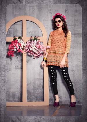 Simple and Elegant Looking Short Kurti Is Here In Dark Peach Color. This?Readymade Kurti In Poly Rayon Based Beautified With Prints All Over. Buy Now.