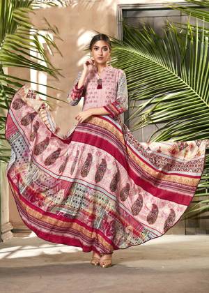 For Your Semi-Casual Wear, Grab This Readymade Gown In Pink Color Beautified With Prints All Over. It Is Fabricated On Soft Silk Which Is Light Weight, Durable And Easy To care For. 