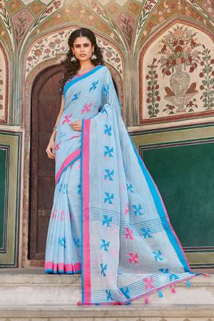 Flaunt Your Rich And Elegant Taste Wearing This Saree In Sky Blue Color Paired With Sky Blue Colored Blouse. This Saree And Blouse Are Fabricated On Linen Cotton Which Gives A Rich Look To Your Personality. 