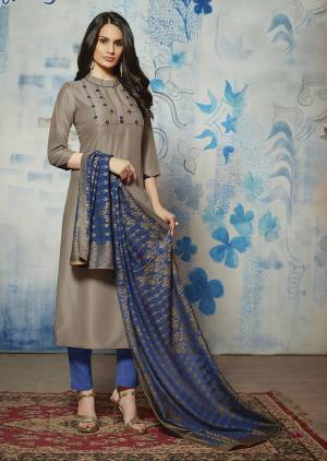 Enhance Your Personality Wearing This Designer Readymade Kurti In Grey Color Paired With Contrasting Navy Blue Colored Dupatta. Its Top Is Fabricated on Muslin Beautified With Hand Work Paired With Jacquard Silk Fabricated Dupatta. 