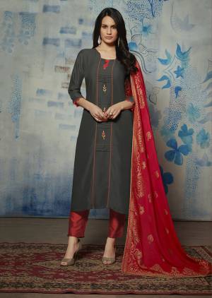 Flaunt Your Rich And Elegant Taste Wearing This Lovely Set Of Kurti With Dupatta In Dark Grey And Red Color Respectively. Its Top Is Fabricated On Muslin Paired With Jacquard Silk Dupatta. 