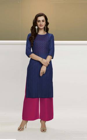 Grab This Beautiful Designer Pair Of Kurti With Plazzo. This Pretty Kurti Is In Navy Blue Color Paired With Dark Pink Colored Bottom. This Pretty Pair Is Cotton Based Which Is Durable, Light Weight And Easy To Carry All Day Long. 