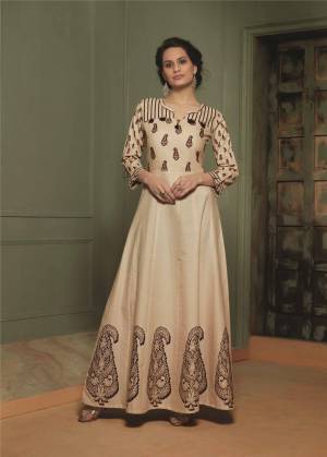 Here Is A Very Beautiful Designer Readymade Long Kurti In Beige Color Fabricated On Cotton Flex. This Pretty Elegant Looking Long Kurti Is Beautified With Prints Giving An Attractive Look. Buy Now.