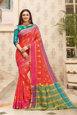 Celebrate This Festive Season With Beauty And Comfort Wearing This Pretty Saree In Dark Pink Color Paired With Contrasting Teal Blue Colored Blouse. This Saree And Blouse Are Fabricated on Cotton Handloom Beautified With Weave. Buy This Saree Now.