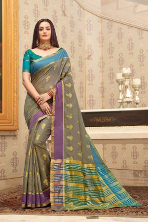 Flaunt Your Rich and Elegant Taste Wearing This Pretty Saree In Grey Color Paired With Teal Blue Colored Blouse. This Saree And Blouse Are Fabricated on Cotton Handloom Gives A Rich Look To Your Personality. 