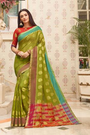 Flaunt Your Rich and Elegant Taste Wearing This Pretty Saree In Green Color Paired With Red Colored Blouse. This Saree And Blouse Are Fabricated on Cotton Handloom Gives A Rich Look To Your Personality. 