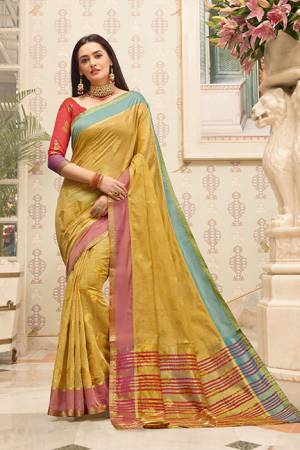 Celebrate This Festive Season With Beauty And Comfort Wearing This Pretty Saree In Light Yellow Color Paired With Contrasting Dark Pink Colored Blouse. This Saree And Blouse Are Fabricated on Cotton Handloom Beautified With Weave. Buy This Saree Now.