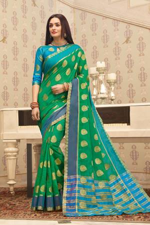 Flaunt Your Rich and Elegant Taste Wearing This Pretty Saree In Sea Green Color Paired With Blue Colored Blouse. This Saree And Blouse Are Fabricated on Cotton Handloom Gives A Rich Look To Your Personality. 