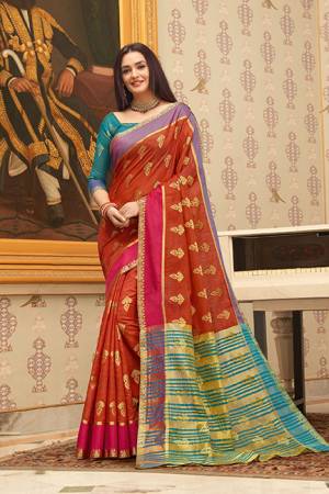 Flaunt Your Rich and Elegant Taste Wearing This Pretty Saree In Red Color Paired With Teal Blue Colored Blouse. This Saree And Blouse Are Fabricated on Cotton Handloom Gives A Rich Look To Your Personality. 