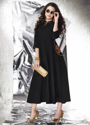 Simple Gown Is Here For Your Semi-Casual Wear In Black Fabricated On Cotton Slub Beautified With Patch Work. This Gown Is Light In Weight And Available In All Regular Sizes. 