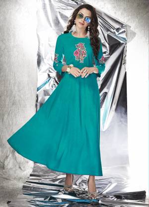 Simple Gown Is Here For Your Semi-Casual Wear In Blue Fabricated On Cotton Slub Beautified With Patch Work. This Gown Is Light In Weight And Available In All Regular Sizes. 
