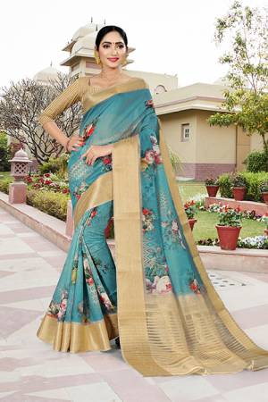 Flaunt Your Rich And Elegant Taste Wearing This Saree In Blue Color Paired With Beige Colored Blouse. This Saree And Blouse Are Fabricated Linen Silk Beautified With Prints And Jacquard Border. 