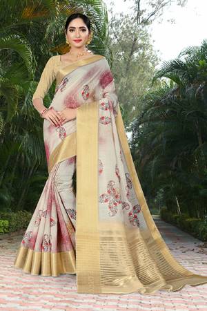 Flaunt Your Rich And Elegant Taste Wearing This Saree In Cream Color Paired With Beige Colored Blouse. This Saree And Blouse Are Fabricated Linen Silk Beautified With Prints And Jacquard Border. 