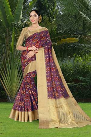 Add This Pretty Saree to Your Wardrobe In Purple Color Paired With Beige Colored Blouse. This Saree And Blouse Are Linen Silk Based Beautified With Prints And Jacquard Lace Border. 