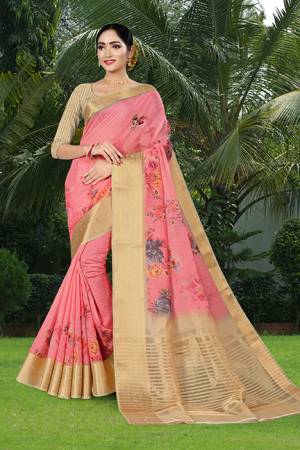 Flaunt Your Rich And Elegant Taste Wearing This Saree In Pink Color Paired With Beige Colored Blouse. This Saree And Blouse Are Fabricated Linen Silk Beautified With Prints And Jacquard Border. 