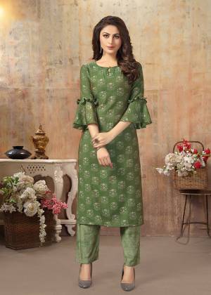Celebrate This Festive Season With Beauty and Comfort Wearing This Designer Readymade Kurti With Pants In Olive Green. This Pretty Set Is Fabricated On Cotton Silk Beautified With Prints. 