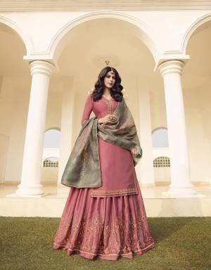 Look Pretty In This Very Beautiful Designer Sharara Suit In Pink Color Paired With Grey Colored Dupatta. Its Top And Bottom Are Muslin Georgette Based Paired With Jacquard Silk Fabricated Dupatta. Buy This Beautiful Semi-Stitched Suit Now.