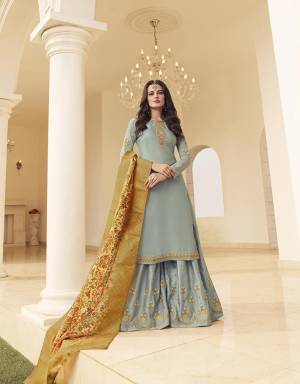 Flaunt Your Rich And Elegant Taste Wearing This New And Trendy Heavy Designer Suit In Baby Blue Color Paired With Contrasting Light Yellow Colored Dupatta. Its Top And Bottom Are Fabricated On Muslin Georgette Paired With Jacquard Silk Fabricated Dupatta. Buy Now.