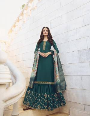 Look Pretty In This Very Beautiful Designer Sharara Suit In Dark Teal Green Color Paired With Sky Blue Colored Dupatta. Its Top And Bottom Are Muslin Georgette Based Paired With Jacquard Silk Fabricated Dupatta. Buy This Beautiful Semi-Stitched Suit Now.
