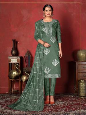 Here Is A Pretty Dress Material In Teal Green Color With Attractive Gota patti Work, Get This Stitched As Per Your Desired Fit And Comfort. Its Top Is Fabricated On Modal Cotton Paired With Santoon Bottom And Art Silk Dupatta. 
