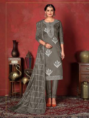 Here Is A Pretty Dress Material In Grey Color With Attractive Gota patti Work, Get This Stitched As Per Your Desired Fit And Comfort. Its Top Is Fabricated On Modal Cotton Paired With Santoon Bottom And Art Silk Dupatta. 