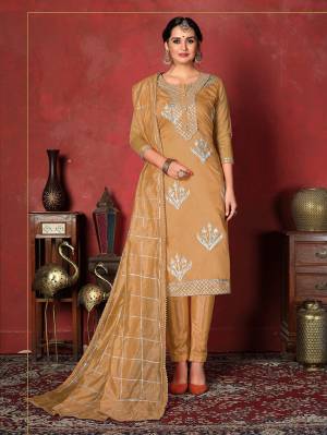 Here Is A Pretty Dress Material In Occur Yellow Color With Attractive Gota patti Work, Get This Stitched As Per Your Desired Fit And Comfort. Its Top Is Fabricated On Modal Cotton Paired With Santoon Bottom And Art Silk Dupatta. 