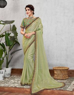 Combining fresh and summery hues with classical embrodieries and contemporary details , this saree is a harmonious medley of perfect combinations. Pair it with simple jewels to look beautiful. 