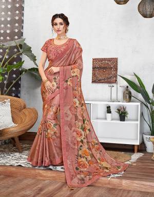 Epitomizing the very aspect of feminine charm and beauty , this floral printed saree with a glamourous touch of sequins is a delicate yet defining pick for the season. 