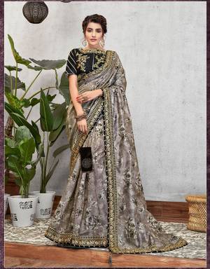 Glorifying artistic style in monochromatic floral prints and regal embroidered details, this saree is an epitome of art, culture and everything feminine. 