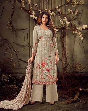 Add This Lovely Designer Straight Suit To Your Wardrobe In Pale Grey Color. Its Heavy Embroidered Top Is Fabricated On Georgette Paired With Santoon Bottom And Chiffon Fabricated Dupatta. It Is Beautified With Floral Prints, Tone To Tone Thread Embroidery and Stone Wok. 