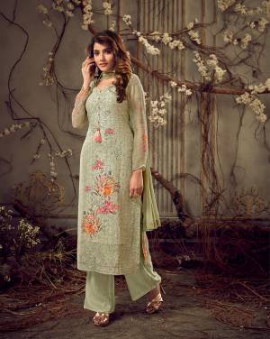 This Season Is About Subtle Shades And Pastel Play, So Grab This Beautiful Designer Straight Cut Suit In Pastel Green Color. Its Top Is Fabricated on Georgette Beautified With Prints, Tone To Tone Embroidery and Stone Work, Paired With Santoon Bottom And Chiffon Fabricated Dupatta. 