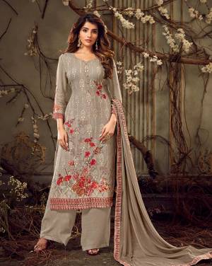 Flaunt Your Rich And Elegant Taste In This Designer Straight Suit In Subtle Grey Color. Its Top Is Georgette Based Paired With Santoon Bottom And Chiffon Fabricated Dupatta. Its Rich Color And Tone To Tone Embroidery Gives A Heavy Yet Subtle Look To Your Personality. 