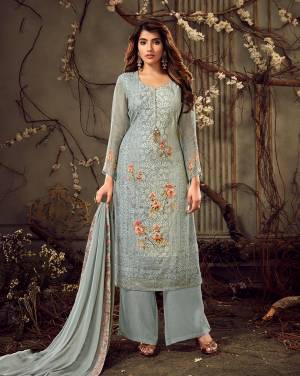 You Will Definitely Earn Lots Of Compliments Wearing This Designer Straight Cut Suit With Tone To Tone Embroidery In Baby Blue Color. Its Pretty Top Is Fabricated On Georgette Paired With Santoon Bottom And Chiffon Fabricated Dupatta. Buy Now.