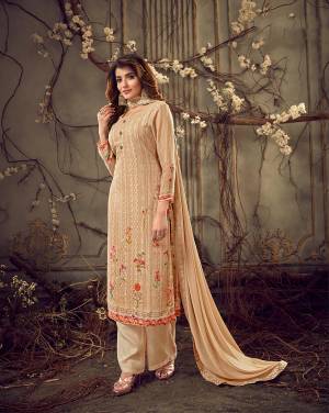 This Season Is About Subtle Shades And Pastel Play, So Grab This Beautiful Designer Straight Cut Suit In Light Beige Color. Its Top Is Fabricated on Georgette Beautified With Prints, Tone To Tone Embroidery and Stone Work, Paired With Santoon Bottom And Chiffon Fabricated Dupatta. 