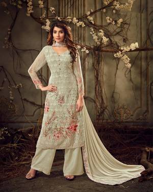 Flaunt Your Rich And Elegant Taste In This Designer Straight Suit In Subtle Light Pastel Green Color. Its Top Is Georgette Based Paired With Santoon Bottom And Chiffon Fabricated Dupatta. Its Rich Color And Tone To Tone Embroidery Gives A Heavy Yet Subtle Look To Your Personality. 