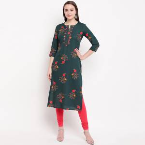 For Your Semi-Casuals, Outing Or Work Place, This Readymade Kurti Is Suitable For All. This Rayon Based Kurti Is In Pine Green Color Beautified With Prints And Hand Work. Buy Now.
