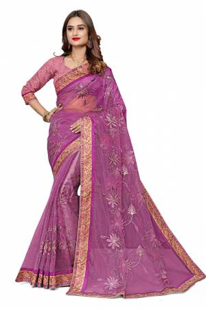 Get Ready For The Upcoming Festive Season With This Designer Saree In Light Purple Color. This Pretty Embroidered Saree Is Net Based Paired With Art Silk Fabricated Blouse. It Is Light Weight And Easy To Drape.