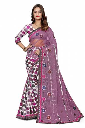 Here Is An Attractive Looking Designer Saree In Lilac And White Pink Color. This Saree Is Fabricated On Jacquard Silk And Net Paired With Jacquard Silk Fabricated Blouse. Buy This Saree Now.