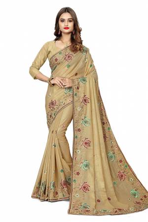 Add This Pretty Designer Saree To Your Wardrobe In Beige Color. This Saree Is Fabricated On Georgette  Paired With Georgette Fabricated Blouse. It Is Beautified With Heavy Attractive Embroidery. 