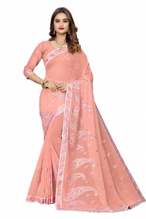 Add This Pretty Designer Saree To Your Wardrobe In Light Peach Color. This Saree Is Fabricated On Georgette  Paired With Georgette Fabricated Blouse. It Is Beautified With Heavy Attractive Embroidery. 