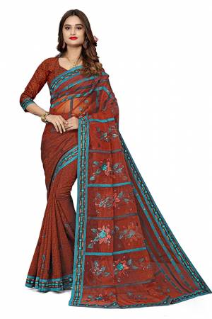 Here Is An Attractive Looking Designer Saree In Rust Red Color. This Saree Is Fabricated On Jacquard Silk And Net Paired With Jacquard Silk Fabricated Blouse. Buy This Saree Now.