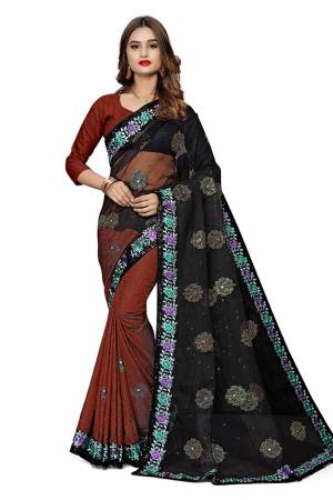 Here Is An Attractive Looking Designer Saree In Black And Rust Color. This Saree Is Fabricated On Jacquard Silk And Net Paired With Jacquard Silk Fabricated Blouse. Buy This Saree Now.