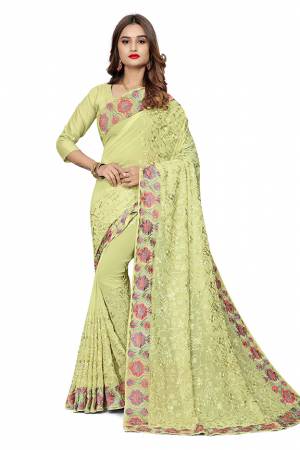 Add This Pretty Designer Saree To Your Wardrobe In Light Pastel Green Color. This Saree Is Fabricated On Georgette  Paired With Georgette Fabricated Blouse. It Is Beautified With Heavy Attractive Embroidery. 