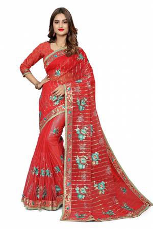 Get Ready For The Upcoming Festive Season With This Designer Saree In Red Color. This Pretty Embroidered Saree Is Net Based Paired With Art Silk Fabricated Blouse. It Is Light Weight And Easy To Drape.