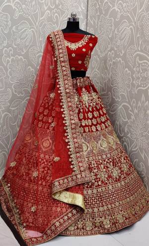 Look Pretty In This Every Girl's Favourite Color For Bridal Wear In All Over Red Colored Lehenga Choli. This Very Beautiful Heavy Designer Lehenga Choli Is Fabricated on Velvet Paired With Net Fabricated Dupatta. Buy Now. Its Attractive Embroidery And Color Will Definitlely Earn You Lots Of Compliments From Onlookers.