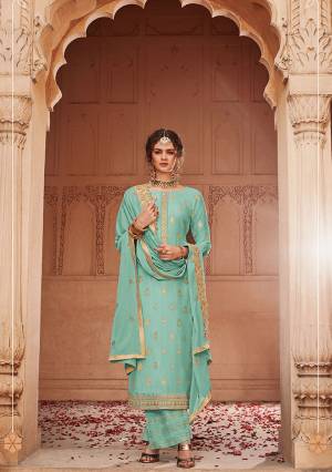 Add This Very Pretty Semi-Stitched Suit To Your Wardrobe In Tuquoise Blue Color. This Heavy Designer Suit Is Fabricated On Jacquard Silk Paired With Santoon Bottom And Chinon Fabricated Dupatta. Its Top and Dupatta are Beautified With Heavy Embroidery Giving You An Attractive Look. 
