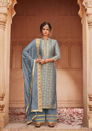 Flaunt Your Rich and Elegnt Wearing This Heavy Designer Straight Suit In All Over Steel Blue Color. Its Top Is Fabricated On Jacquard Silk Beautified With Embroidery And Weave Paired With Santoon Bottom and Heavy Embroidered Chinon Fabricate Dupatta. Buy Now.