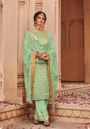 Look Pretty In This Heavy designer Straight Suit In Pretty Light Green Color. Its Top Is Fabricated On Jacquard Silk Paired With Santoon Bottom And Chinon Fabricated Heavy Embroidered Dupatta. Its Pretty Color And Embroidery Will Definitely Earn You Lots Of Compliments From Onlookers. 