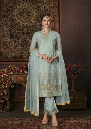 Grab This Beautiful Shade In Blue With This Designer Straight Suit In Aqua Blue Color. Its Pretty Embroidered Top and Dupatta Are Net Based Paired With Soft Silk Fabricated Bottom. It Is Beautified With Attractive Jari And Resham Embroidery With Stone Work. 