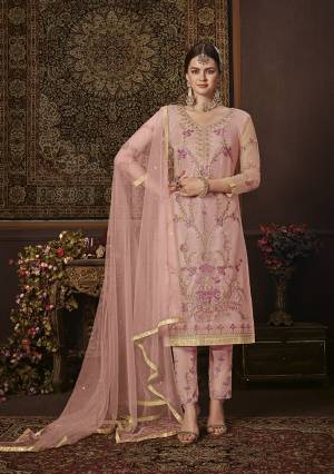 Look Pretty In This Beautiful Designer Straight Suit In Baby Pink Color. Its Top Is Fabricated On Net Paired With Soft Silk Bottom and Net Fabricated Dupatta. It Is Beautified With Attractive Embroidery. 